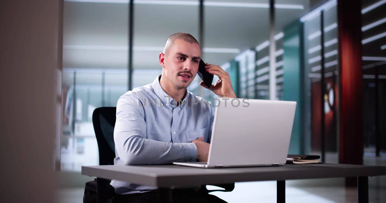 Businessman Utilizing Smartphone To Check Online House Listing Contact