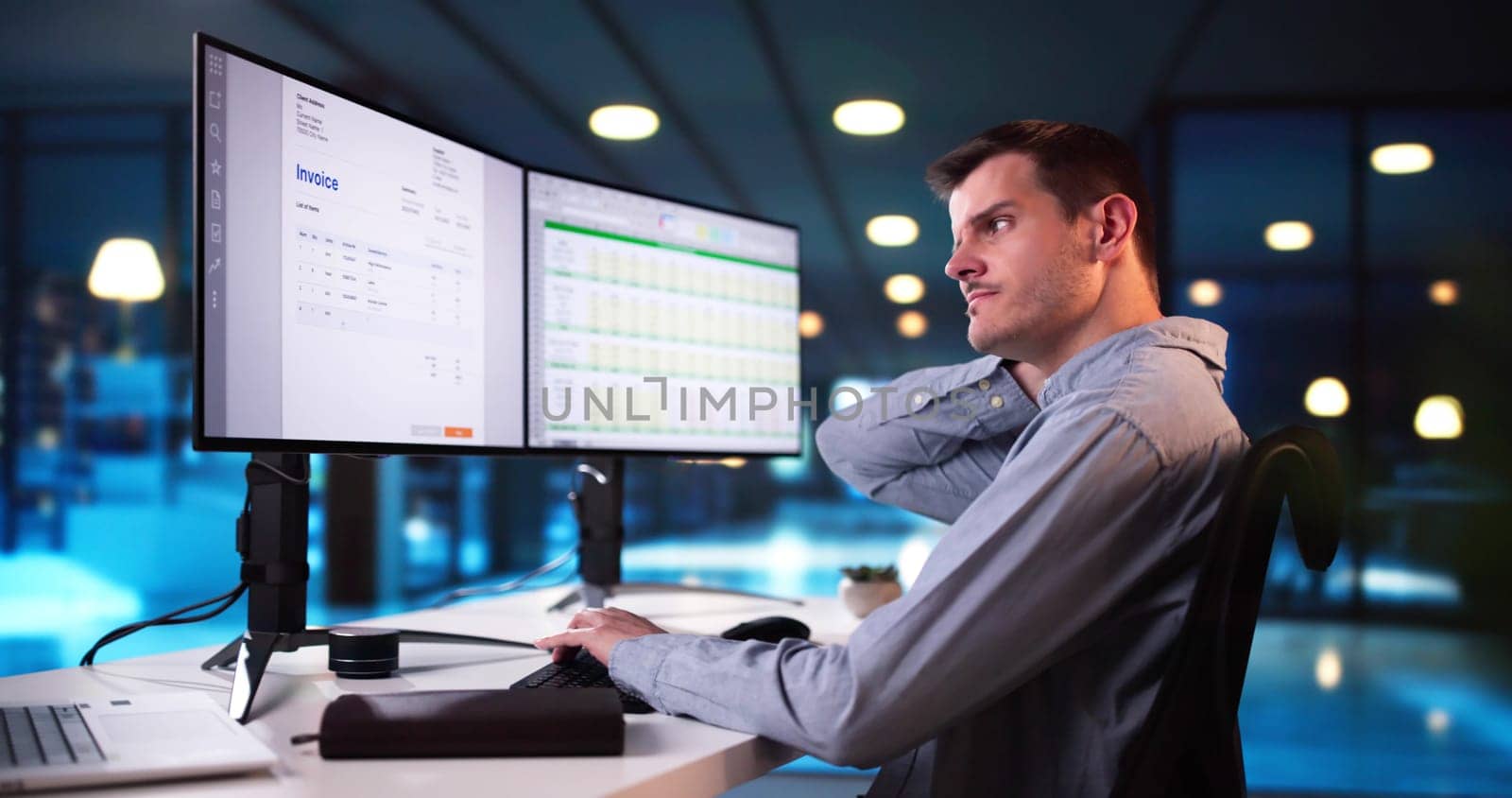Young Businessman Having Back Pain While Sitting