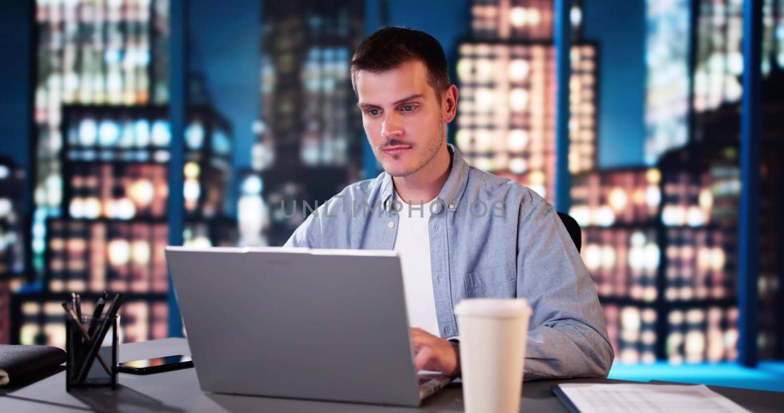 Successful Stock Market Trader Looking At Graphs On Multiple Screens