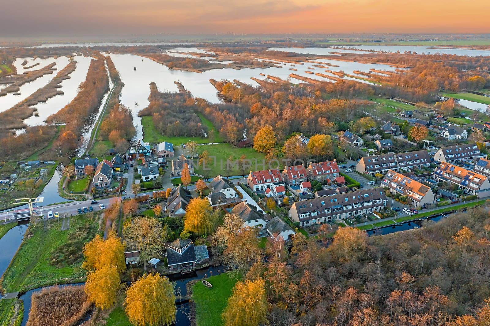 Aerial from Ankeveen at the Ankeveense Plassen in the Netherlands at sunset