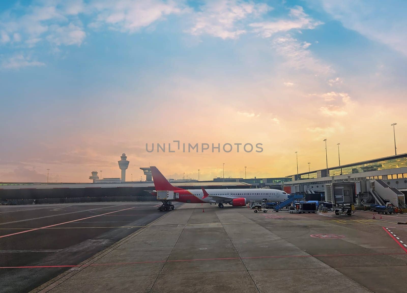 Airplane standing at the gate on Schiphol airport in the Netherlands