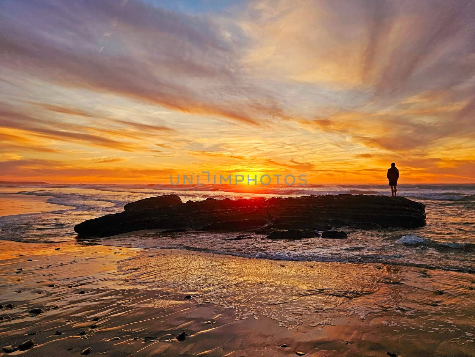 Beautiful sunset at Praia Vale Figueiras in Portugal