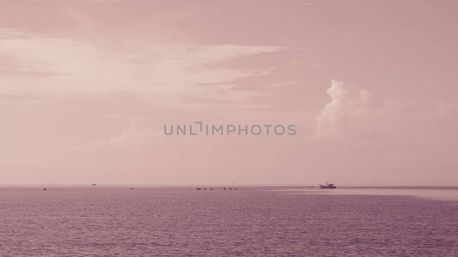 Atmosphere panorama white cloud clear sky horizon line calm empty sea lone fishing boat sunset sunrise red orange tone. Concept paradise life. Design relax wallpaper background. More tone in stock.
