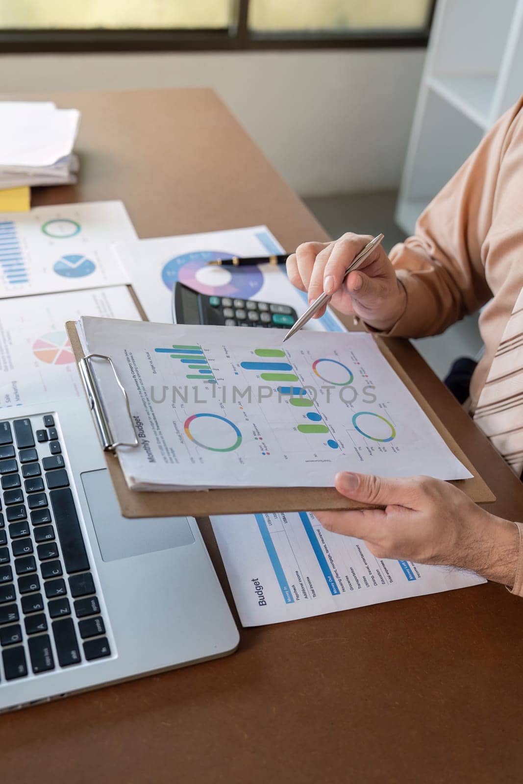 Analyzing key business metrics with detailed charts and graphs for strategic decision-making in a corporate setting.