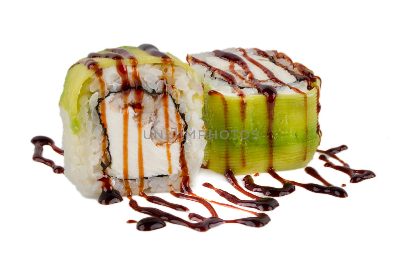Sushi roll on a white background with Philadelphia cheese, avocado and tuna, sprinkled with soy sauce.