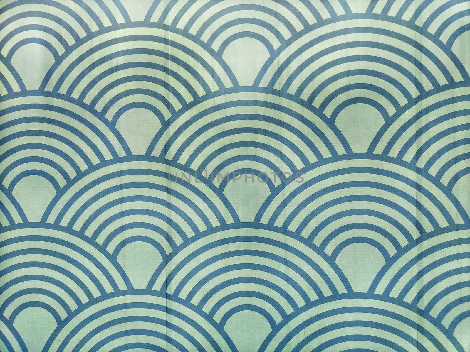 Vibrant blue and green curved lines form a harmonious wave pattern, providing a calming backdrop for creative projects.