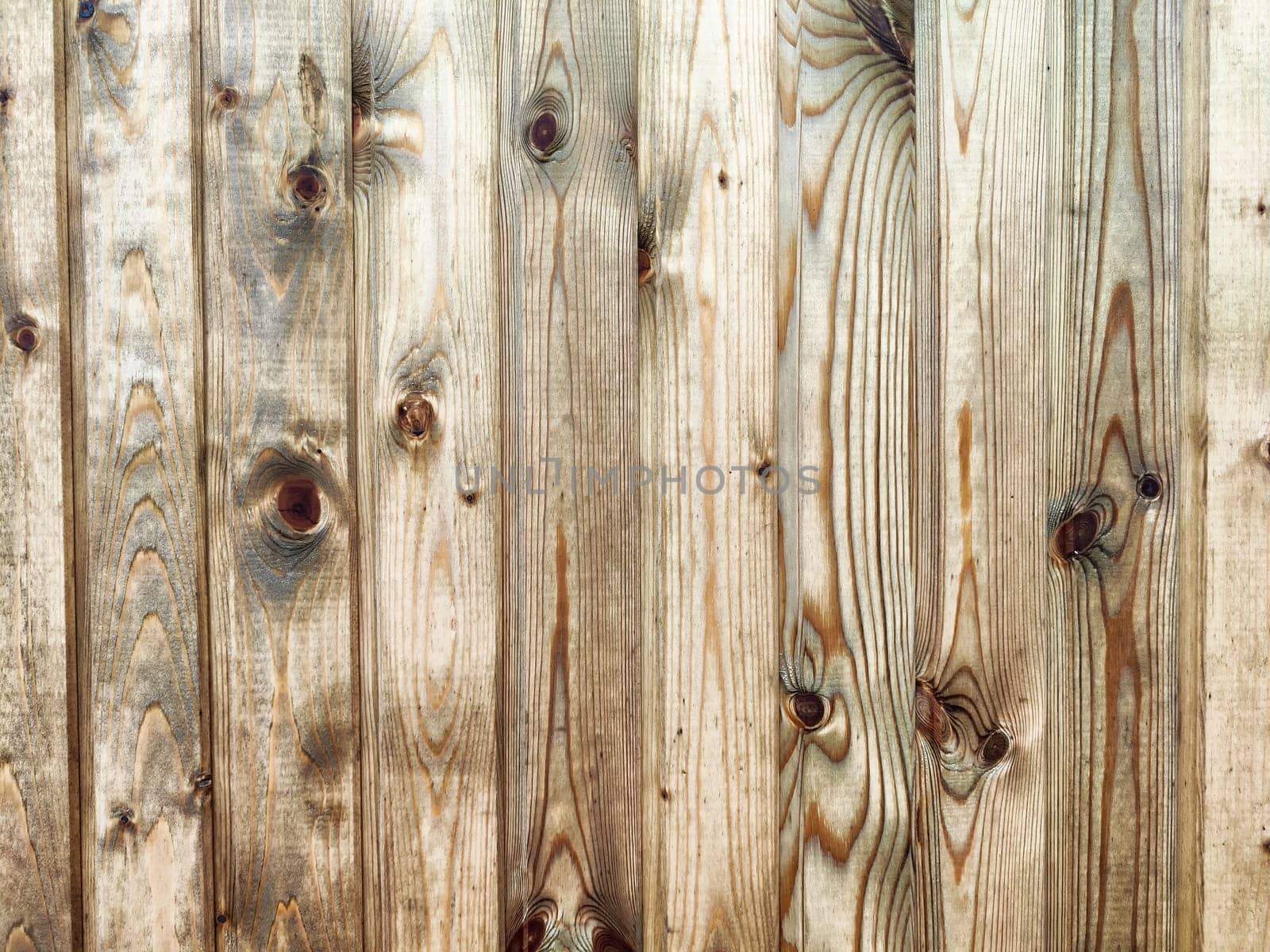 This surface features a rustic wooden texture with visible knots and grains, perfect for adding a natural element to any design or project.