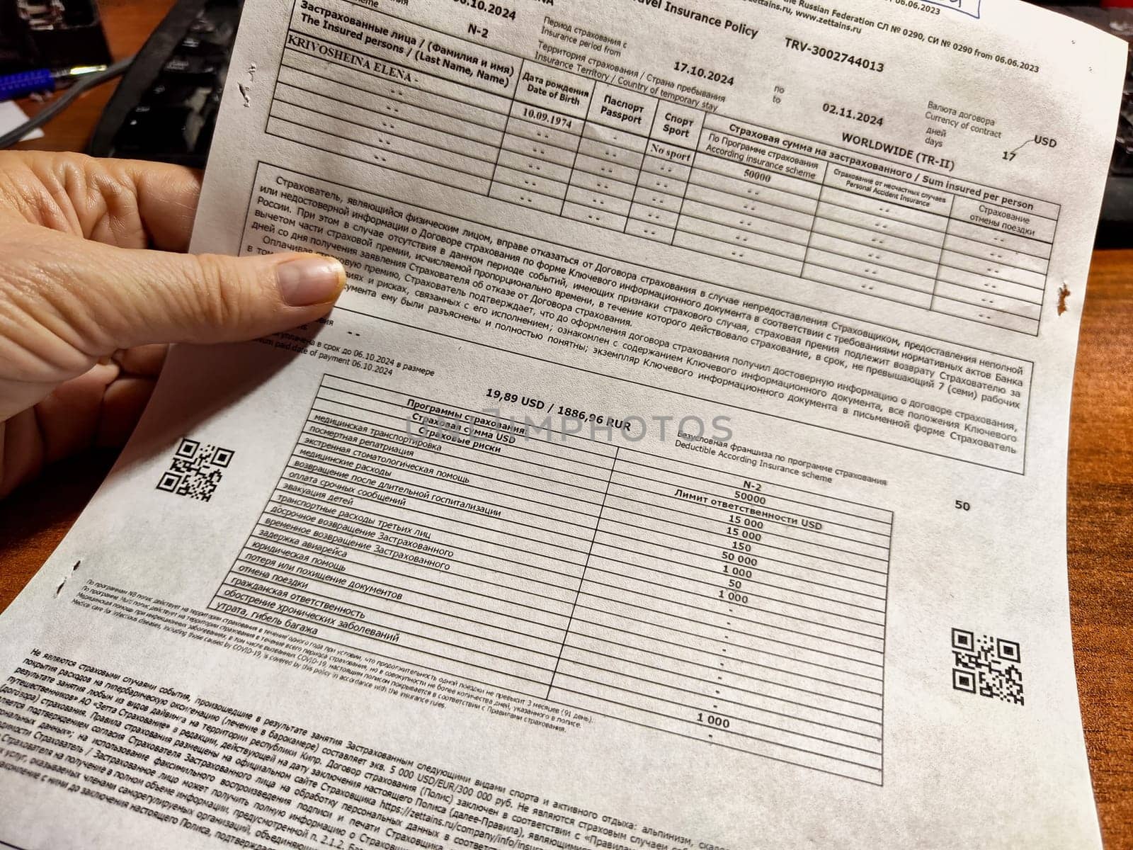Kirov, Russia - October 06, 2024: Detailed document listing various travel insurance coverage options and relevant policy information for travelers safety.