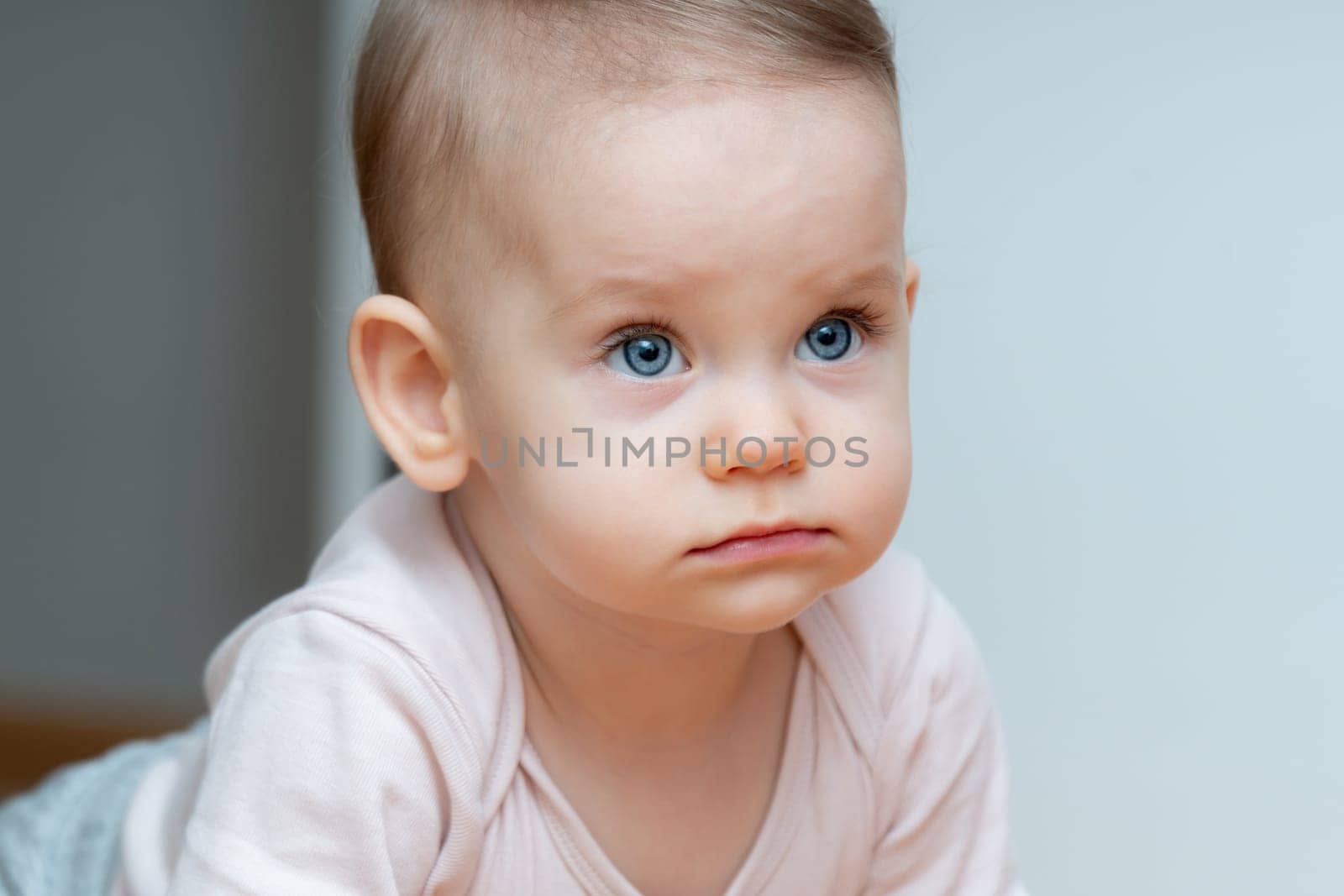 Attentive baby crawling with a focused gaze