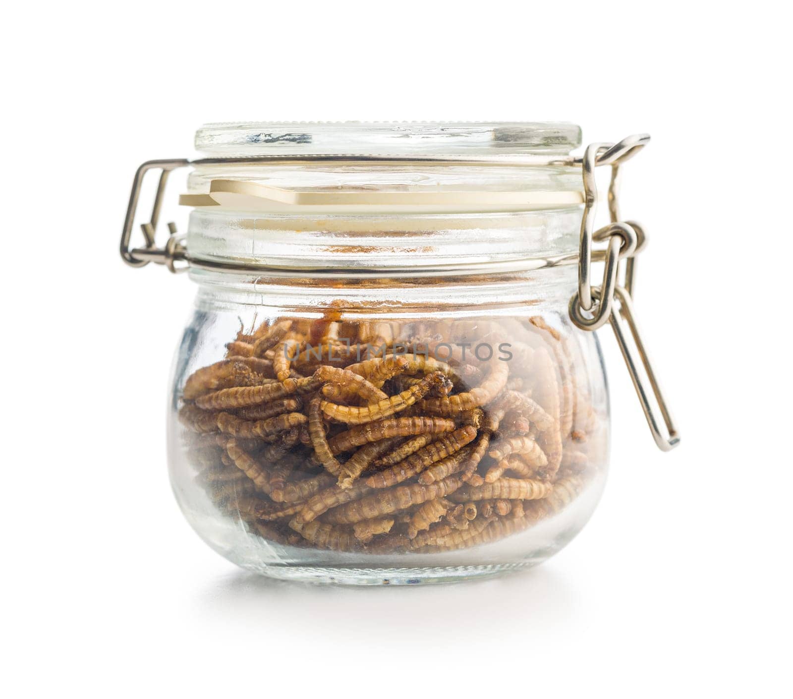 Dried salted worms. Roasted mealworms in jar isolated on a white background.