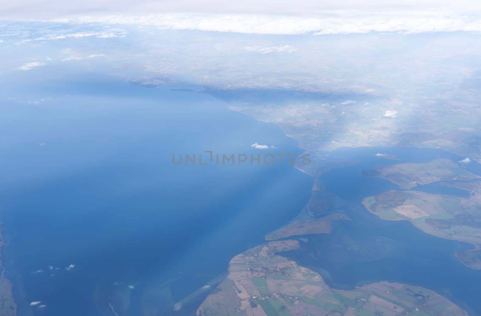 View from airplane window to earth's surface. High quality photo