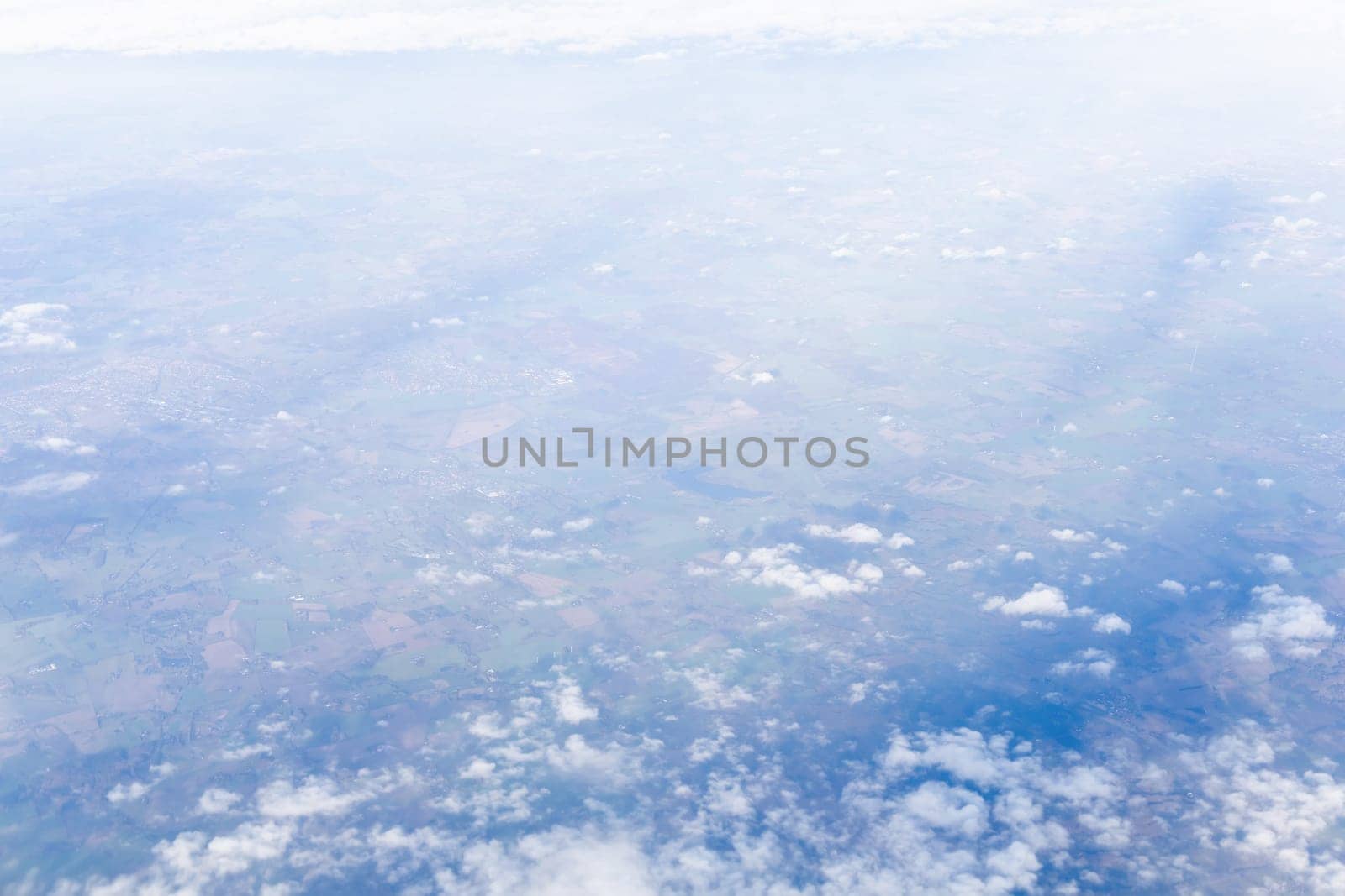 View from airplane window to earth's surface. High quality photo