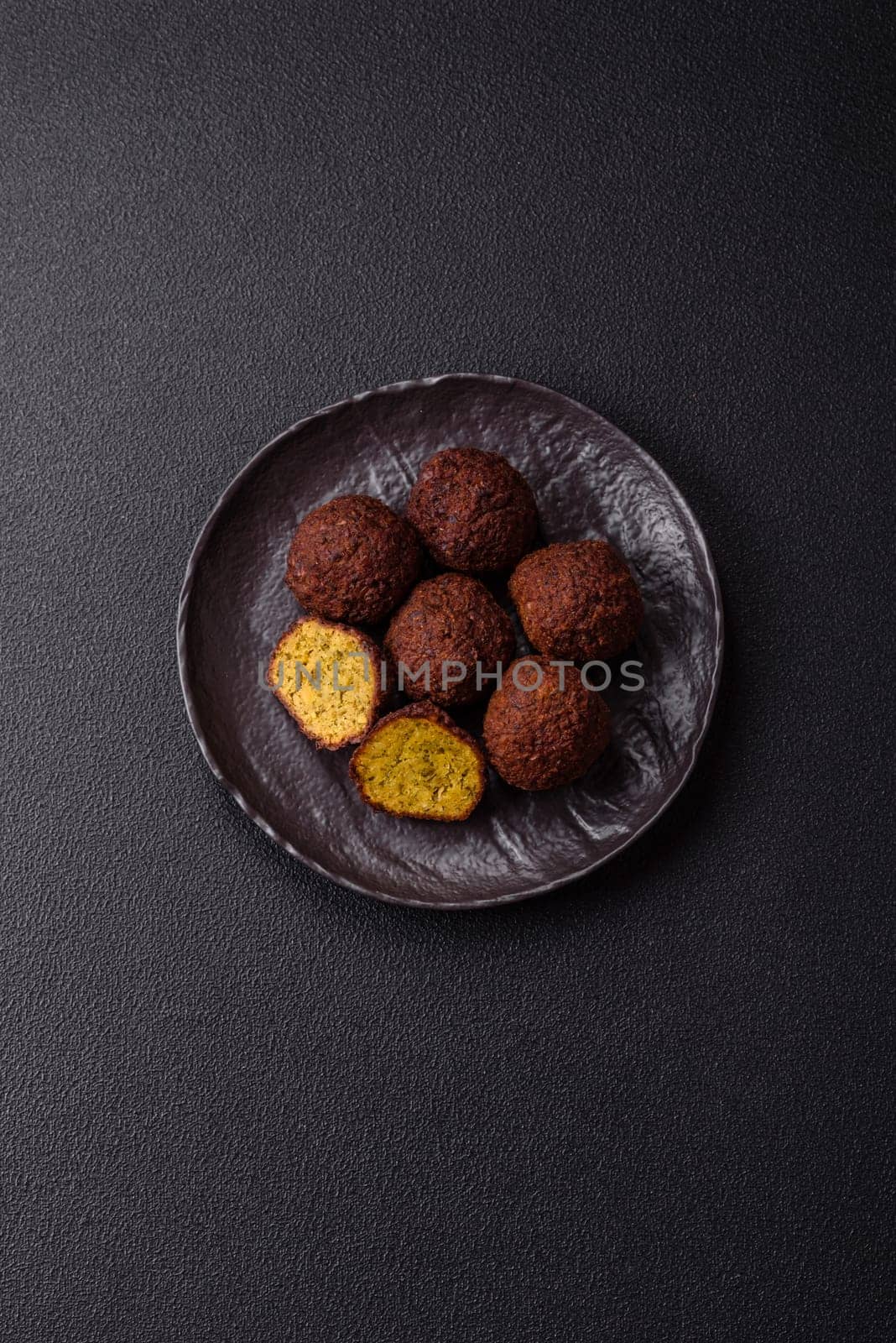 Fried chickpea falafel balls with salt, spices and herbs. Vegetarian and vegan dish