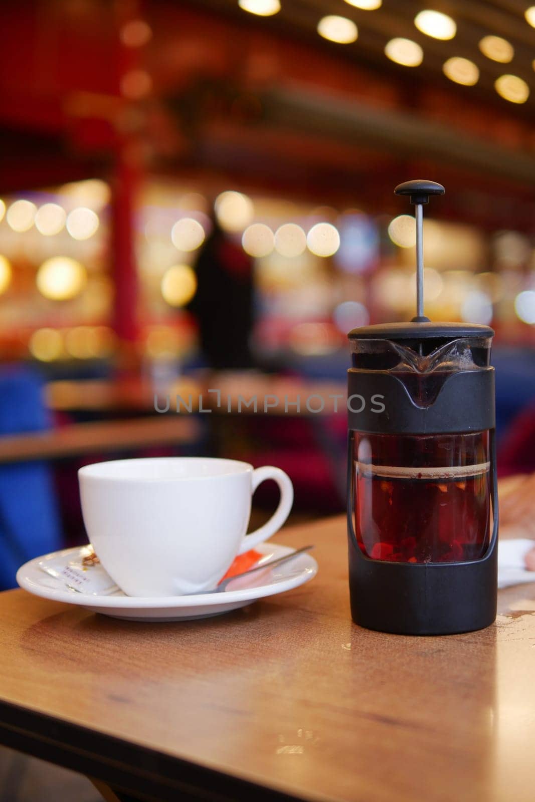Enjoy herbal tea brewed in a French press, with fresh lemon slices for extra flavor