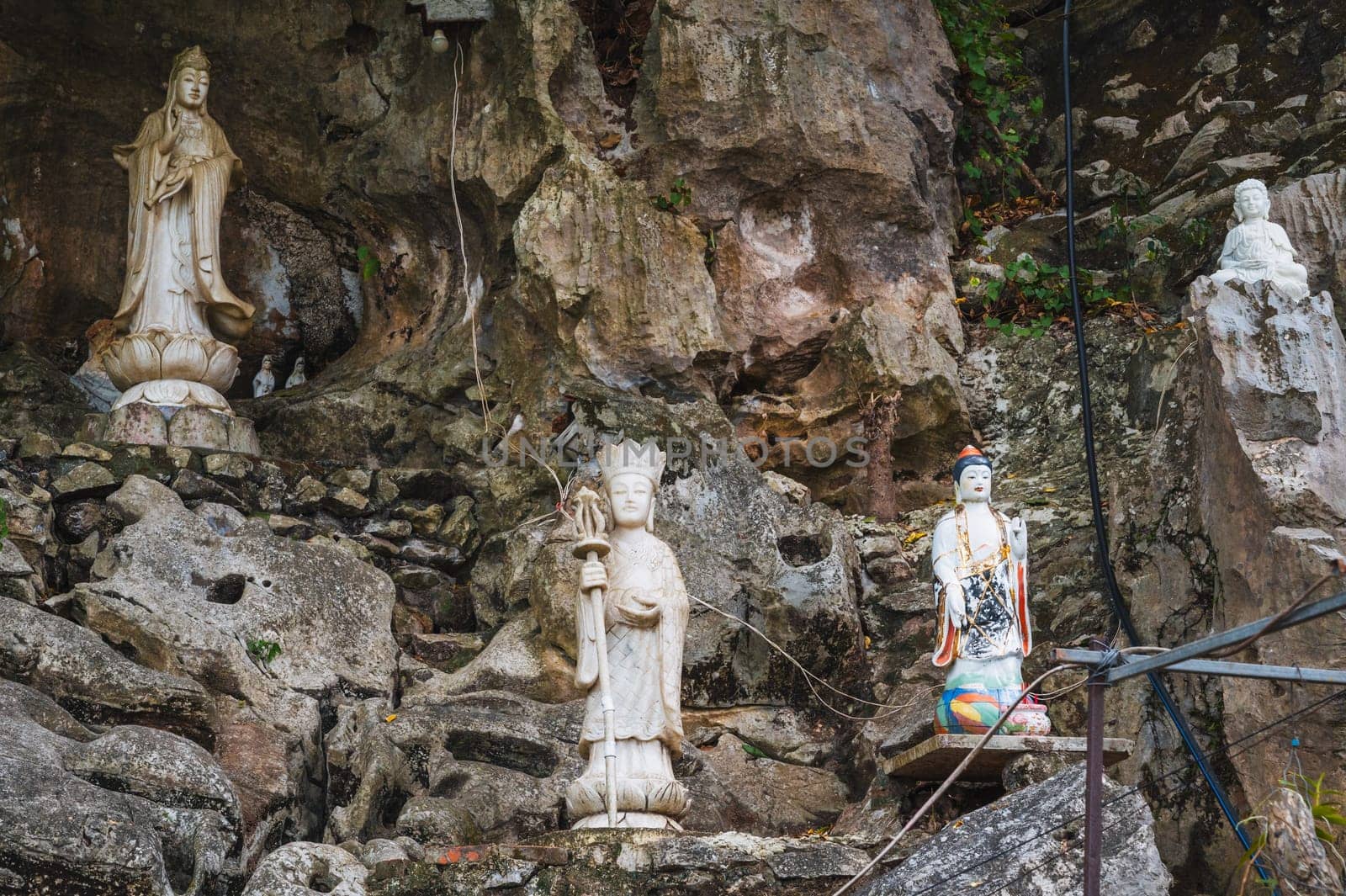 Buddha sculptures in the garden at the pagoda in the marble mountains of Da Nang