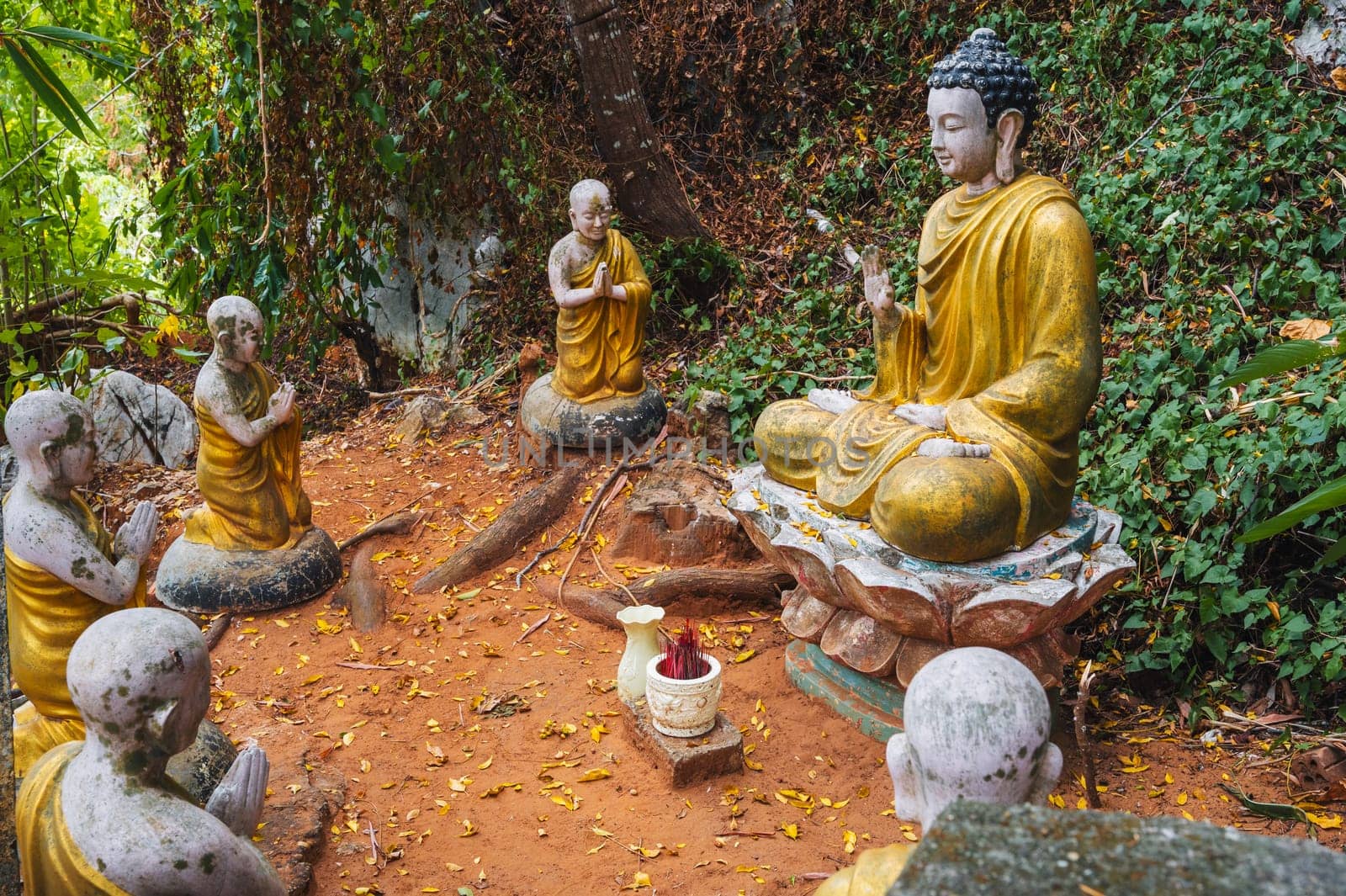 Buddha sculptures in the garden at the pagoda in the marble mountains of Da Nang