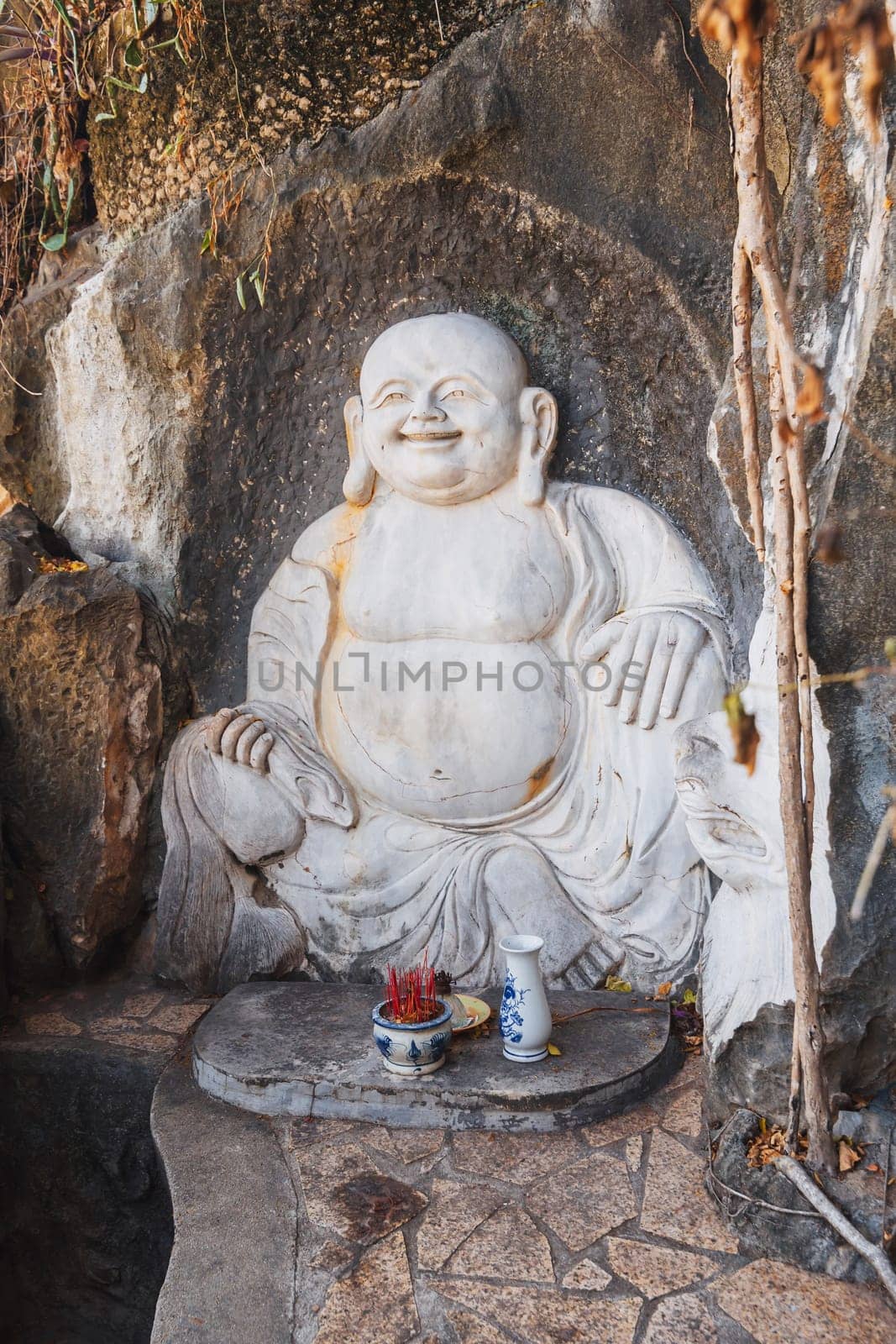 Buddha sculpture in the garden at the pagoda in the marble mountains of Da Nang