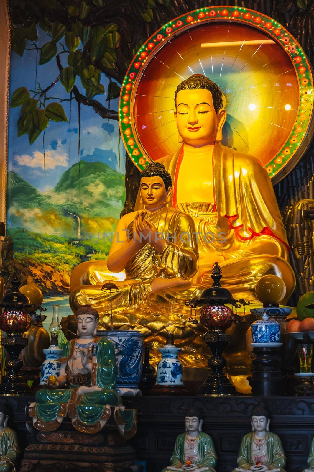An altar with a golden Buddha in a pagoda on the marble mountains of Da Nang