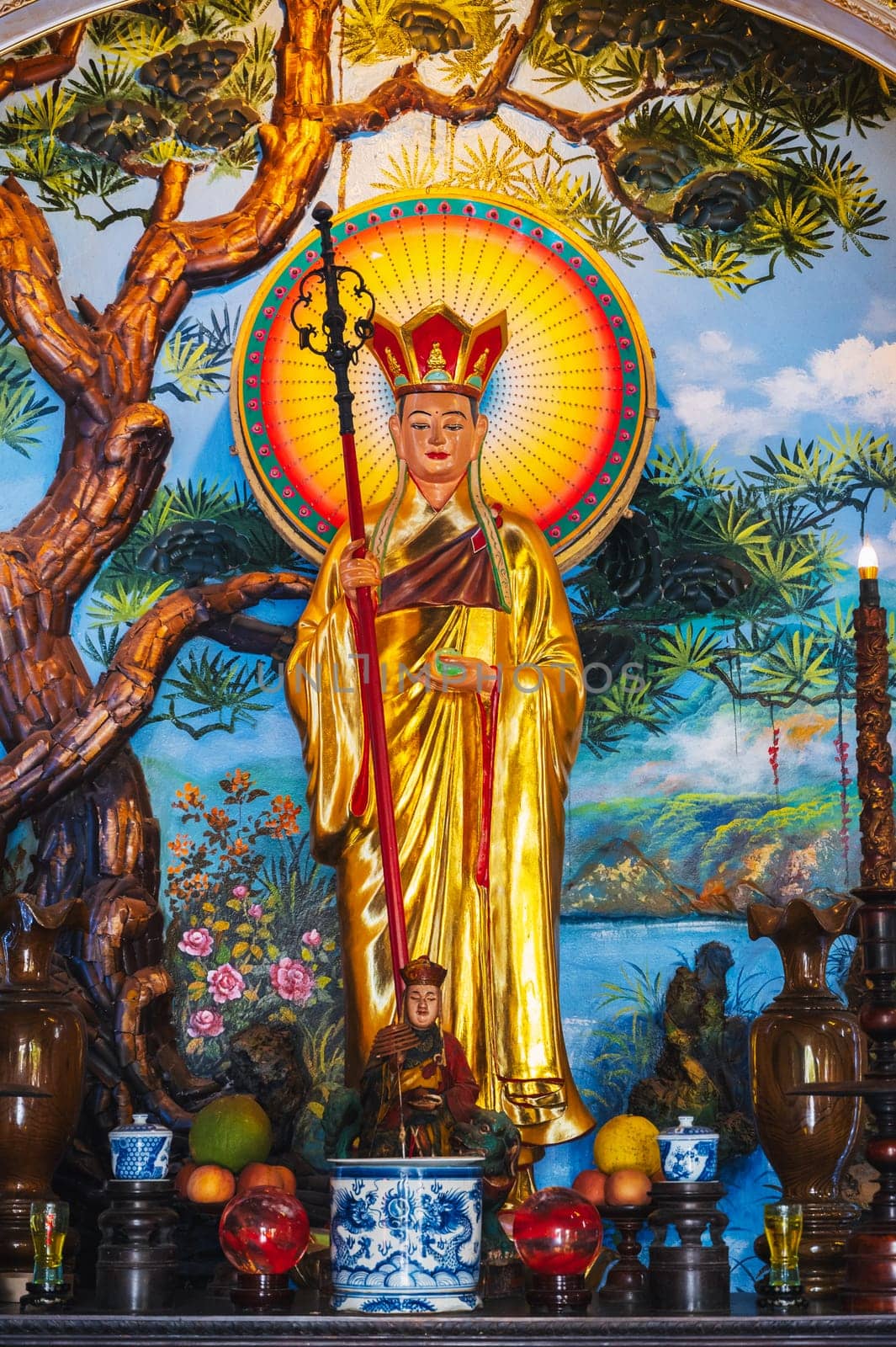 An altar with a Buddhist god inside a pagoda on the marble mountains of Da Nang