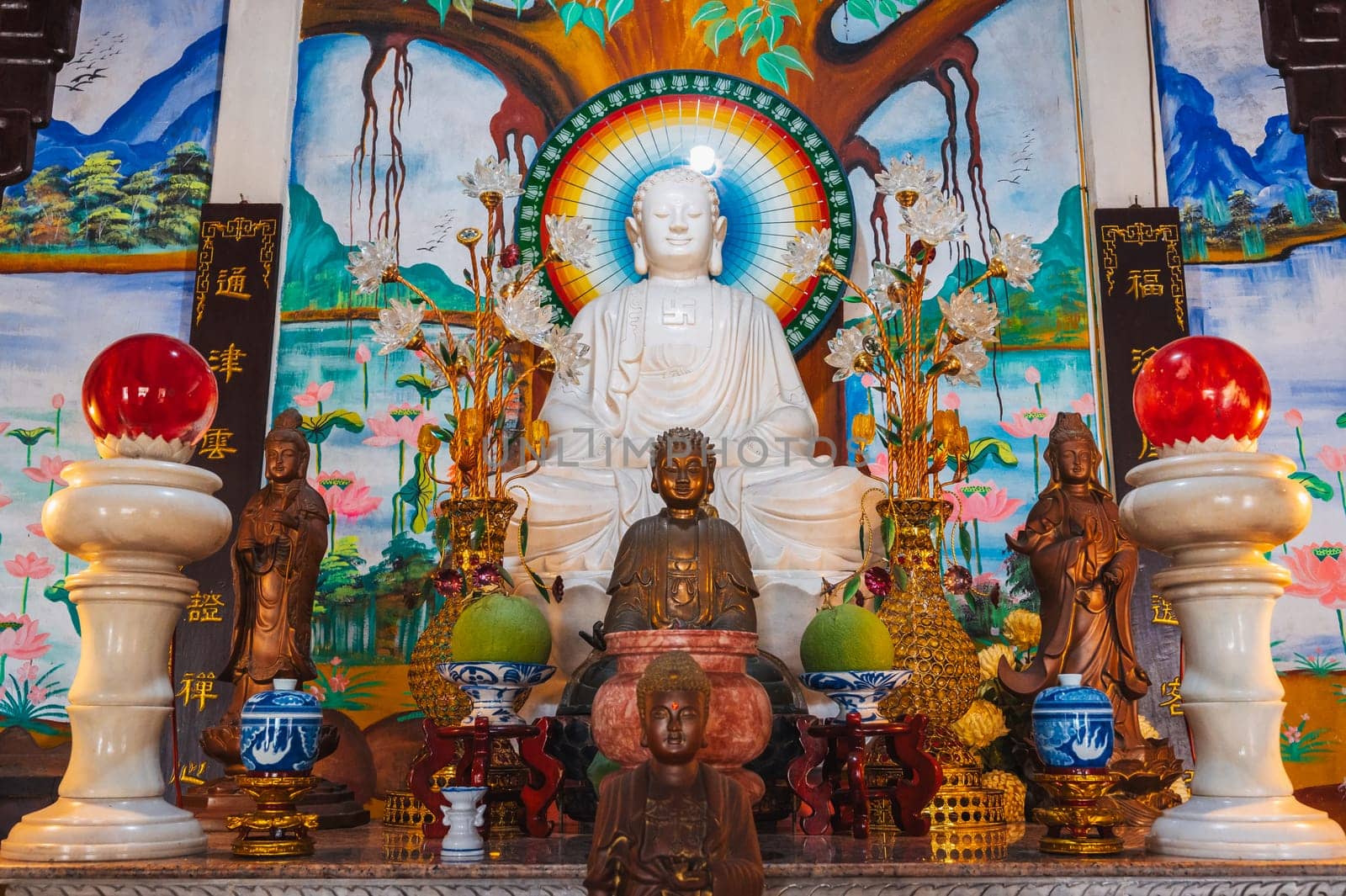 An altar with a Buddha inside a temple-pagoda on the marble mountains in Da Nang, Vietnam.