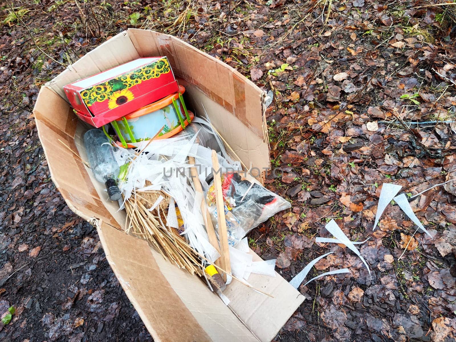 Refuse strewn across a forested area illustrates the growing issue of pollution and its impact on natural habitats.