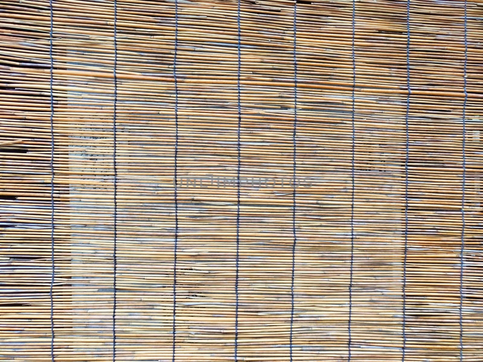 This textured background features natural woven materials, offering a simple pattern with ample space for text placement in design work.