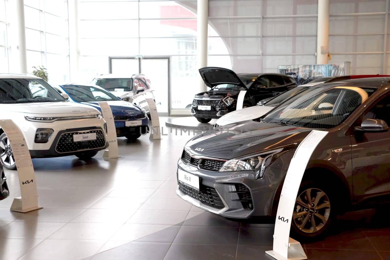 Kazan, Russia - November 25, 2022: Cars in showroom of dealership Kia in Kazan in Russia. Partial focus