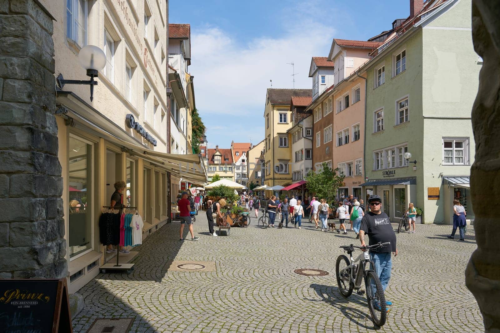 Lindau, Germany – July 29, 2024: Tourists in a pedestrian zone in the old town in the Insel district of Lindau on Lake Constance, Bodensee