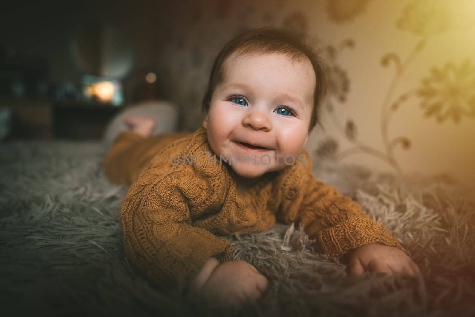 Adorable cute baby girl lying on bed and smiling. Adorable kid portrait. 5 month old child. Childhood concept. High quality photo