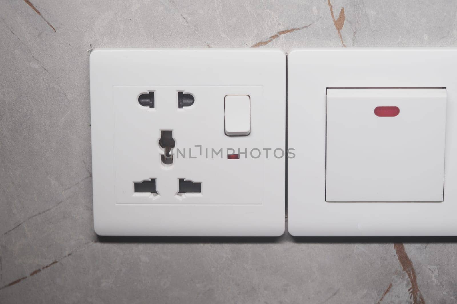 Contemporary electrical outlet with a light switch, perfect for interior design.