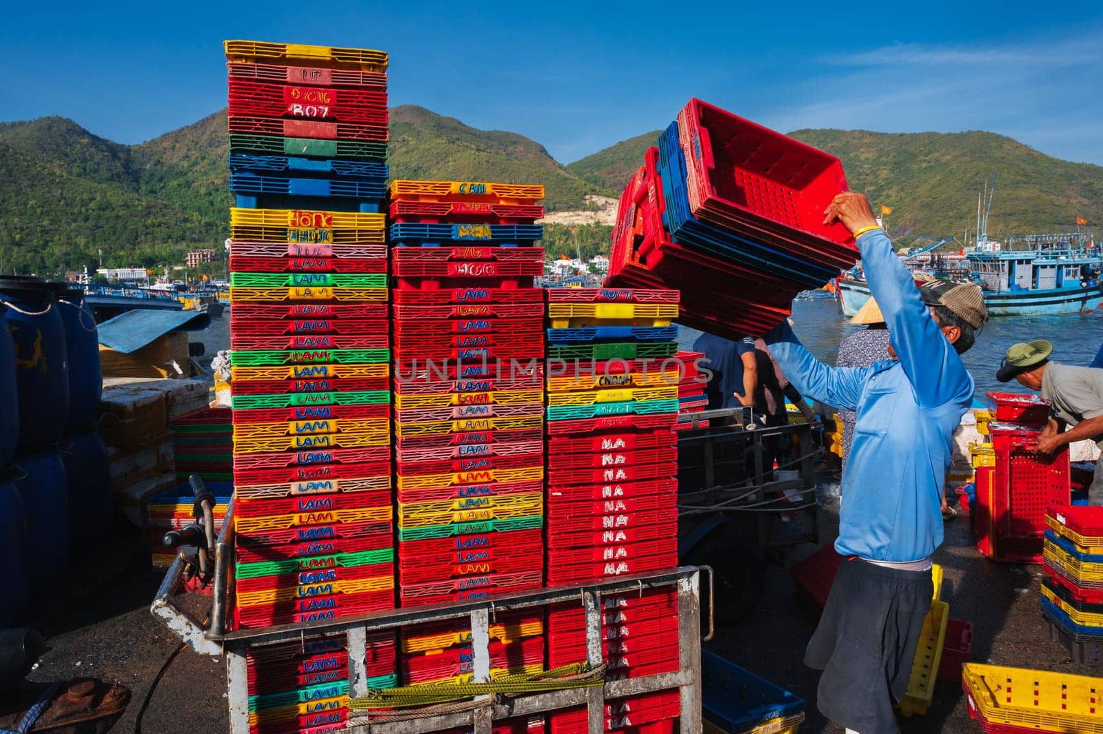 The local Asian fish market in the harbor where the goods are being unloaded