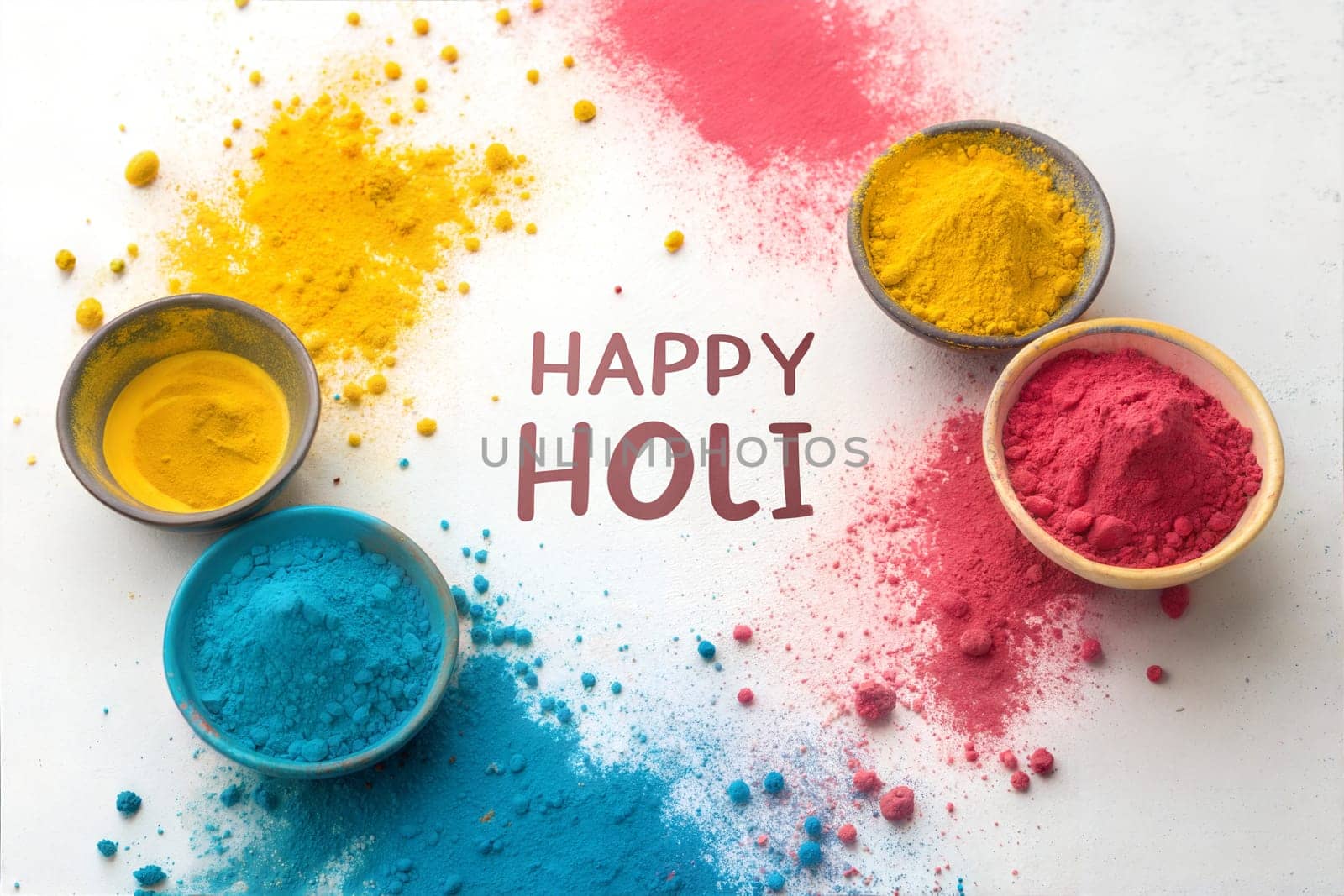 Gulal colors in bowls for Indian Holi festival. Happy Holi, festival of colors on white background. Holi concept banner.