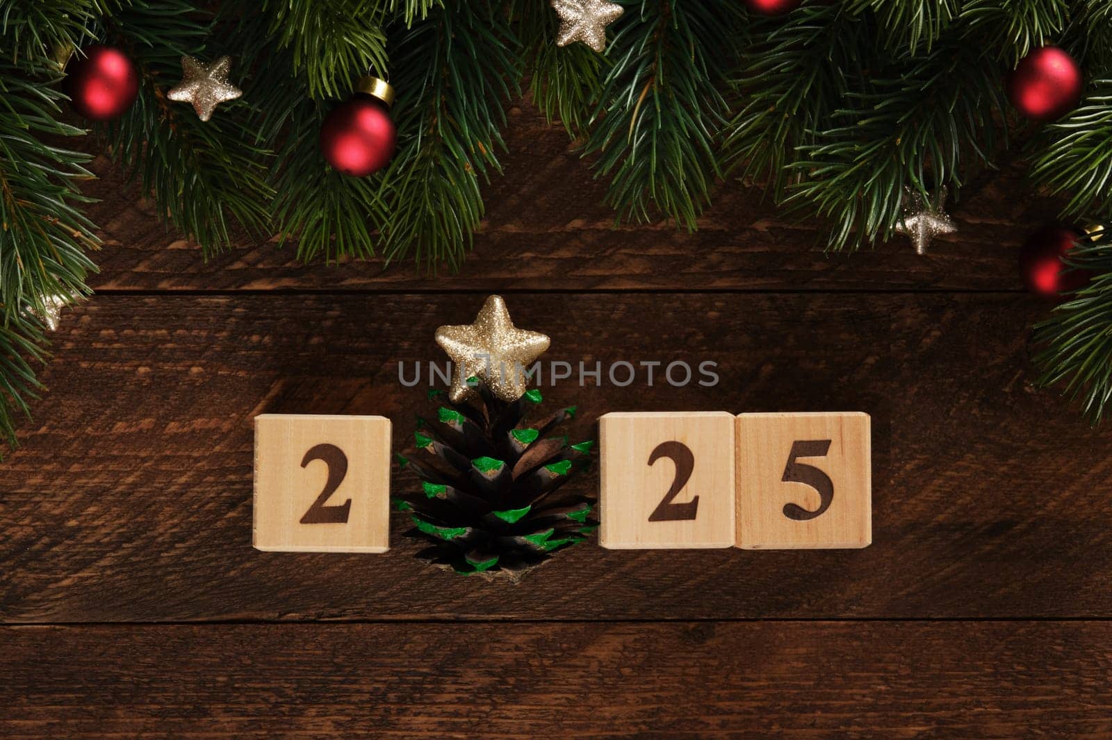 Figures 2025 New Year wooden blocks with fir branches, red Christmas tree balls and gold stars