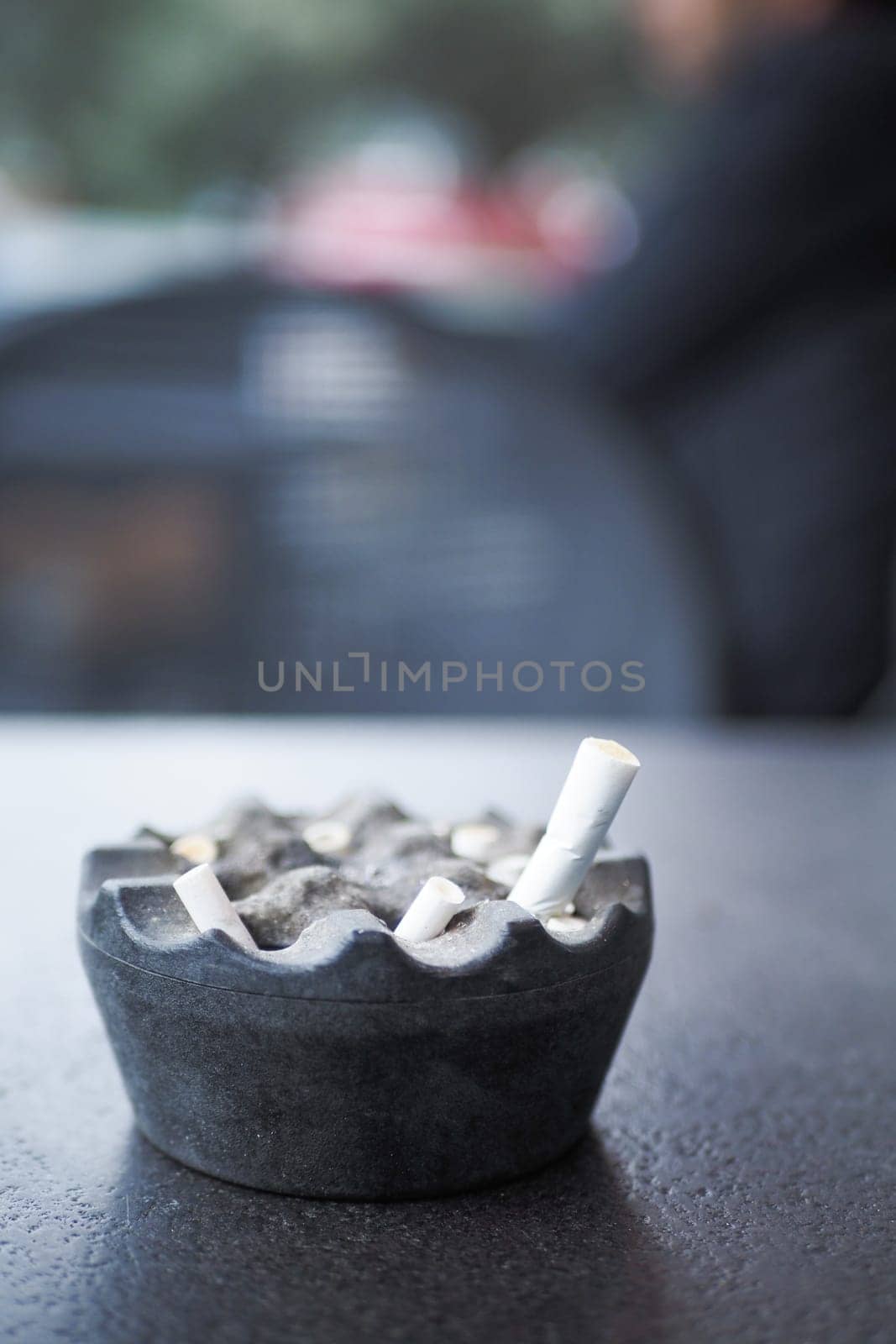 Close up burning cigarette in ashtray ,