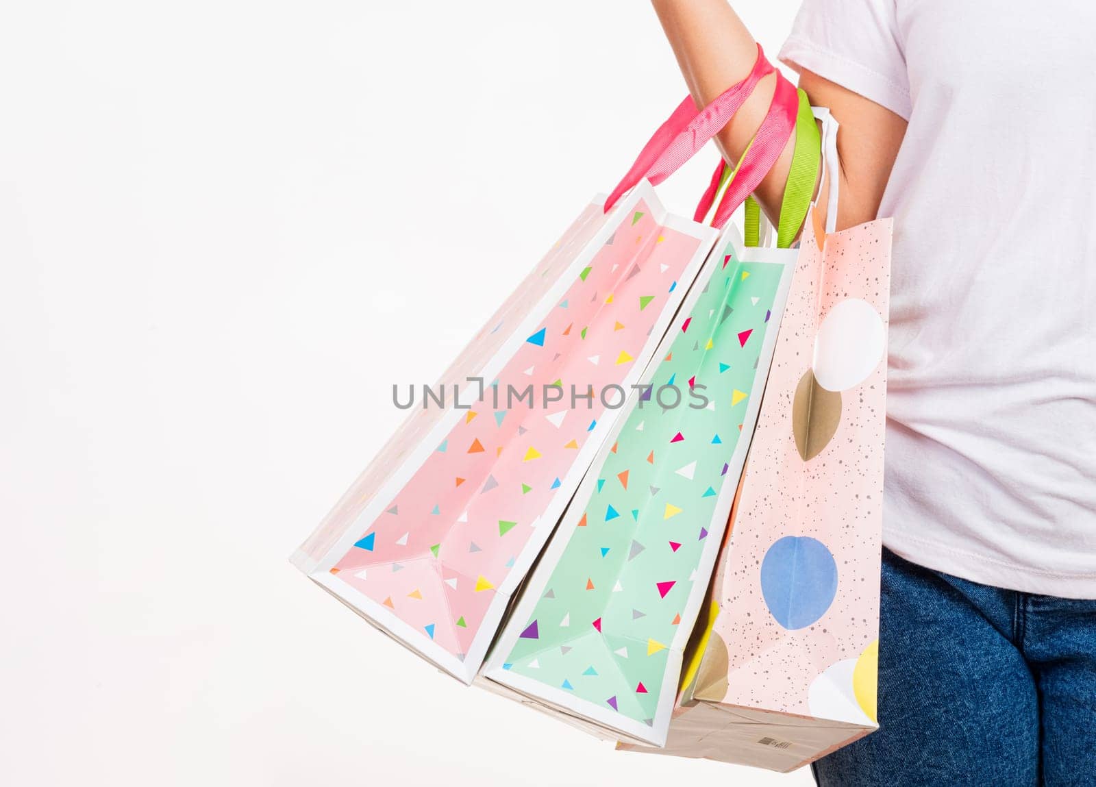 woman hand holding shopping bags multicolor by Sorapop