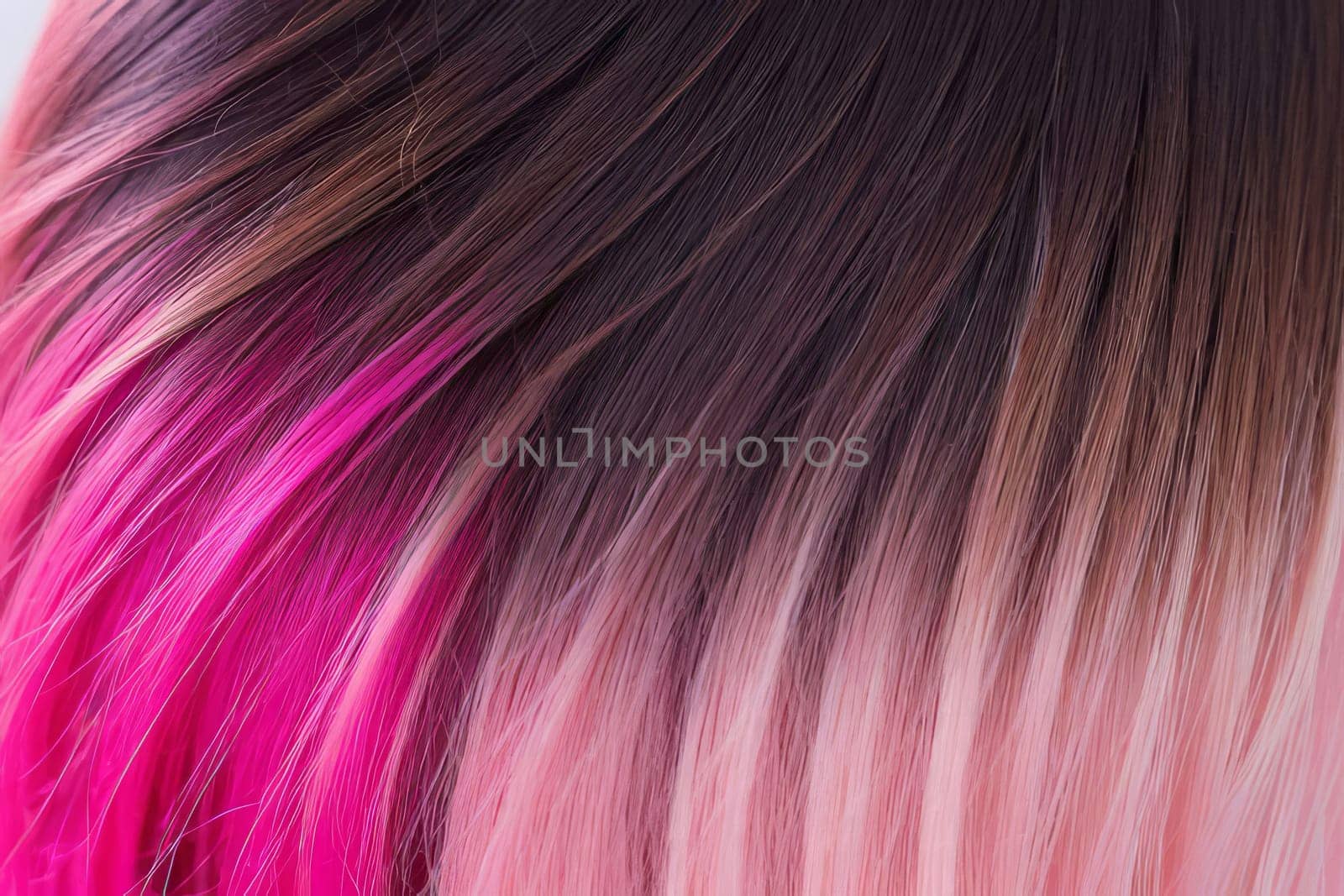 This close-up photo accentuates the vibrant allure of pink hair in an ombre design, revealing a harmonious fusion of colors and textures