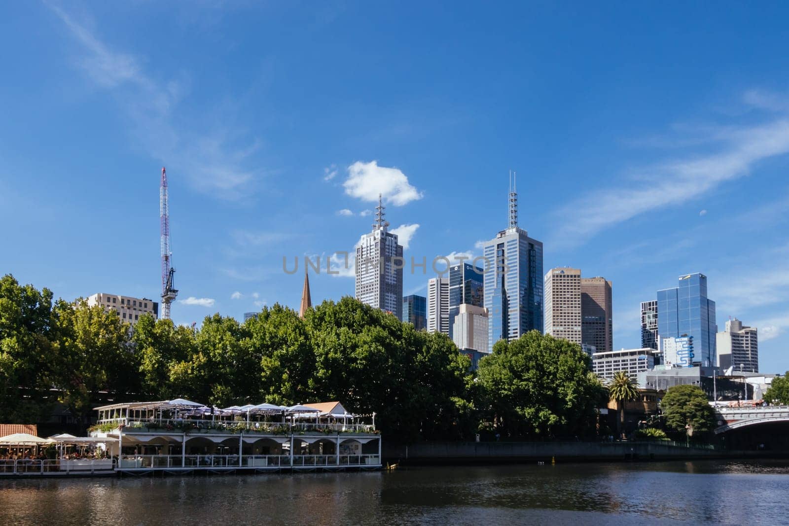 MELBOURNE, AUSTRALIA - JANUARY 08, 2025: Views towards Melbourne CBD and Princes Bridge along the Yarra River from Southbank in Melbourne, Victoria, Australia