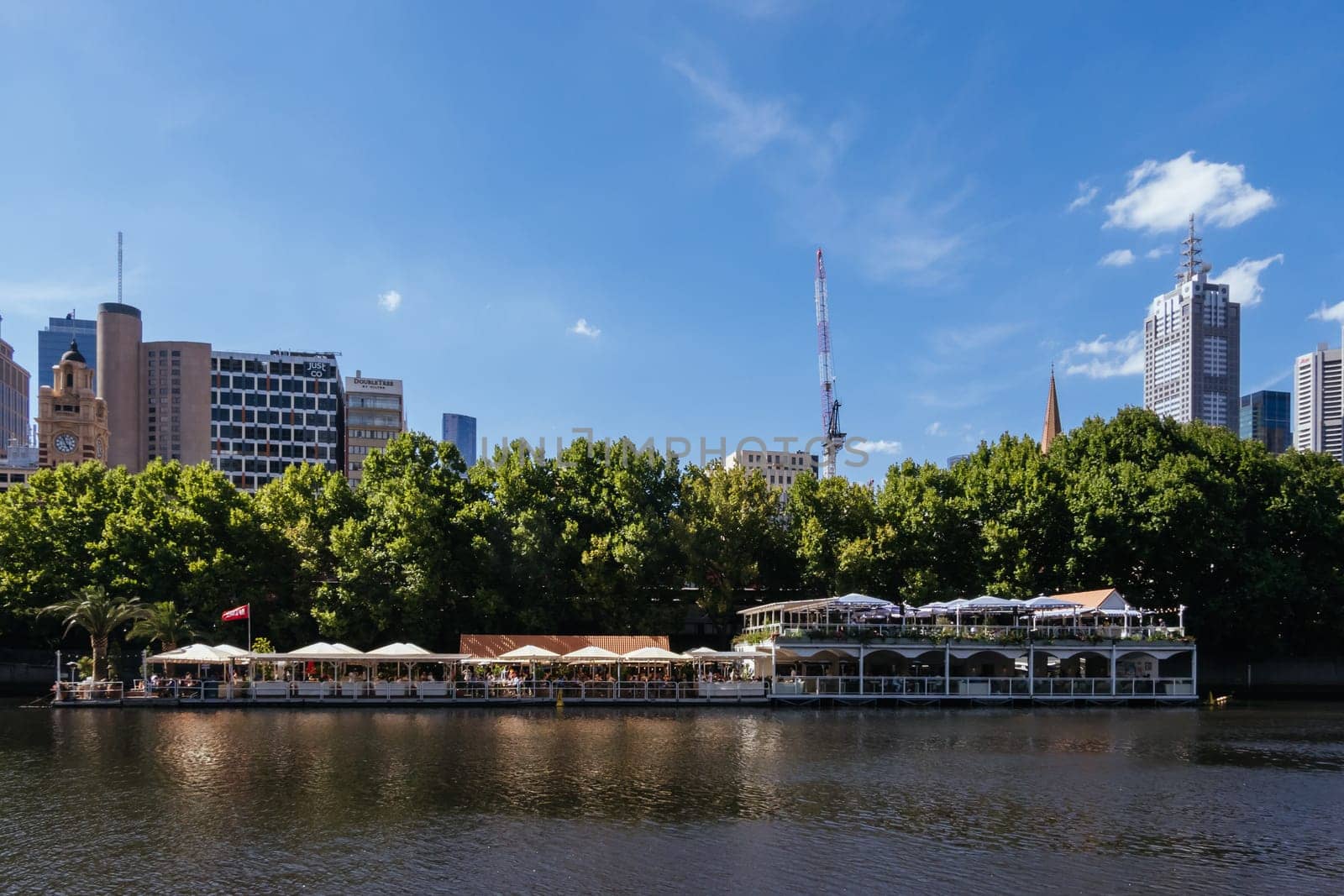 MELBOURNE, AUSTRALIA - JANUARY 08, 2025: Views towards Melbourne CBD and Princes Bridge along the Yarra River from Southbank in Melbourne, Victoria, Australia
