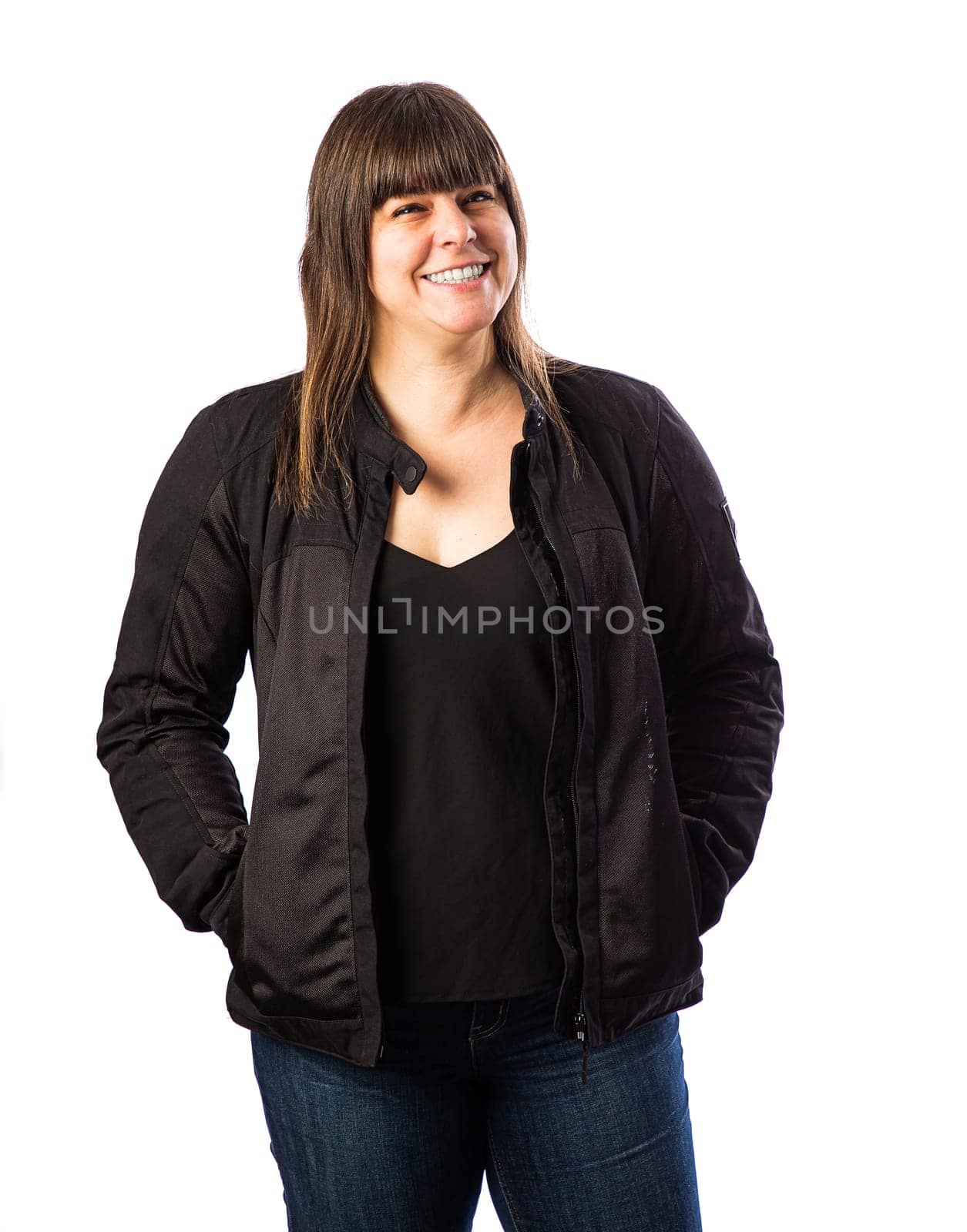 Forty something woman wearing a motocycle jacket, isolated  white background