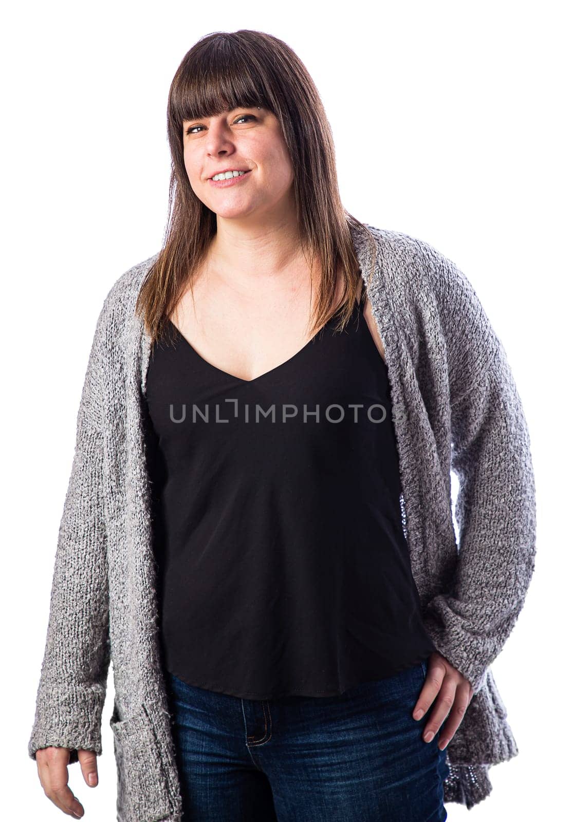 Portrait of a forty something woman, wearing casual clothes, with a smile, isolated against a white background