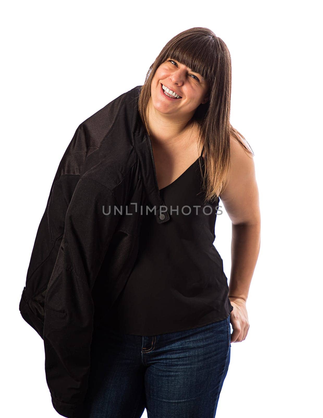 Forty something woman, wearing casual clothes, with her jacket over her shoulder