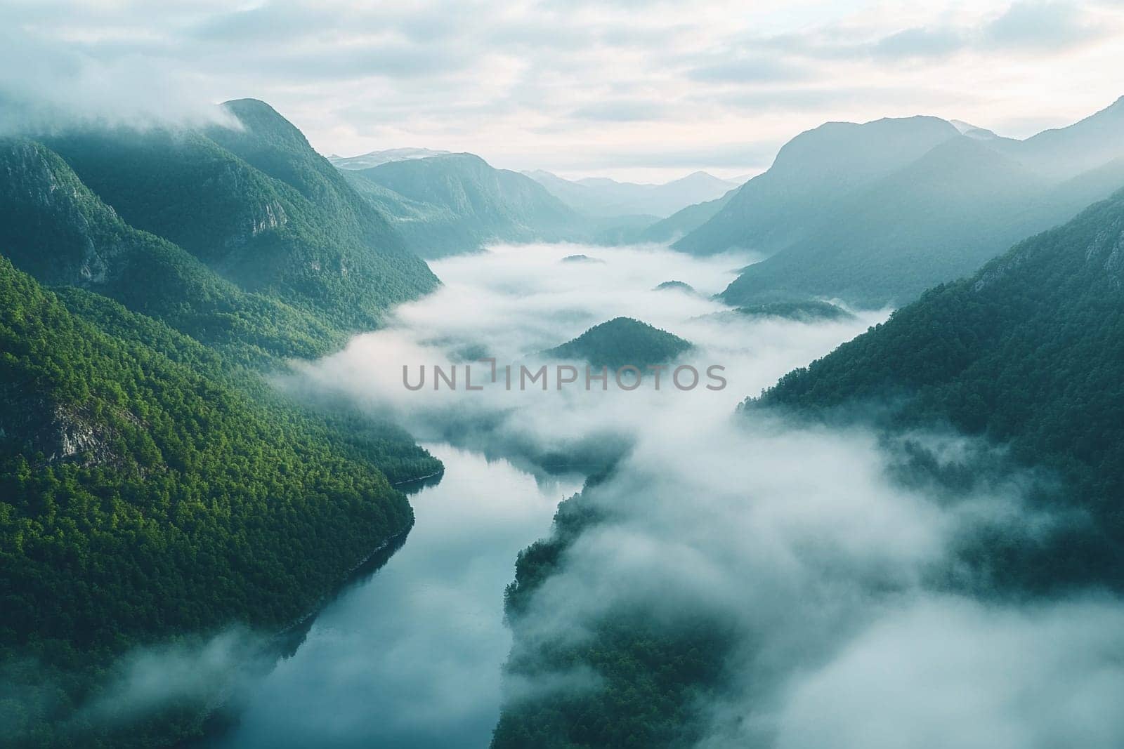 Soft fog blankets a serene river valley surrounded by lush mountains, creating an enchanting landscape at dawn.