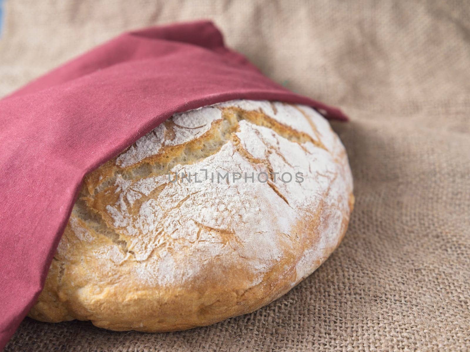 A close up photo of a round loaf of artisanal home baked bread.