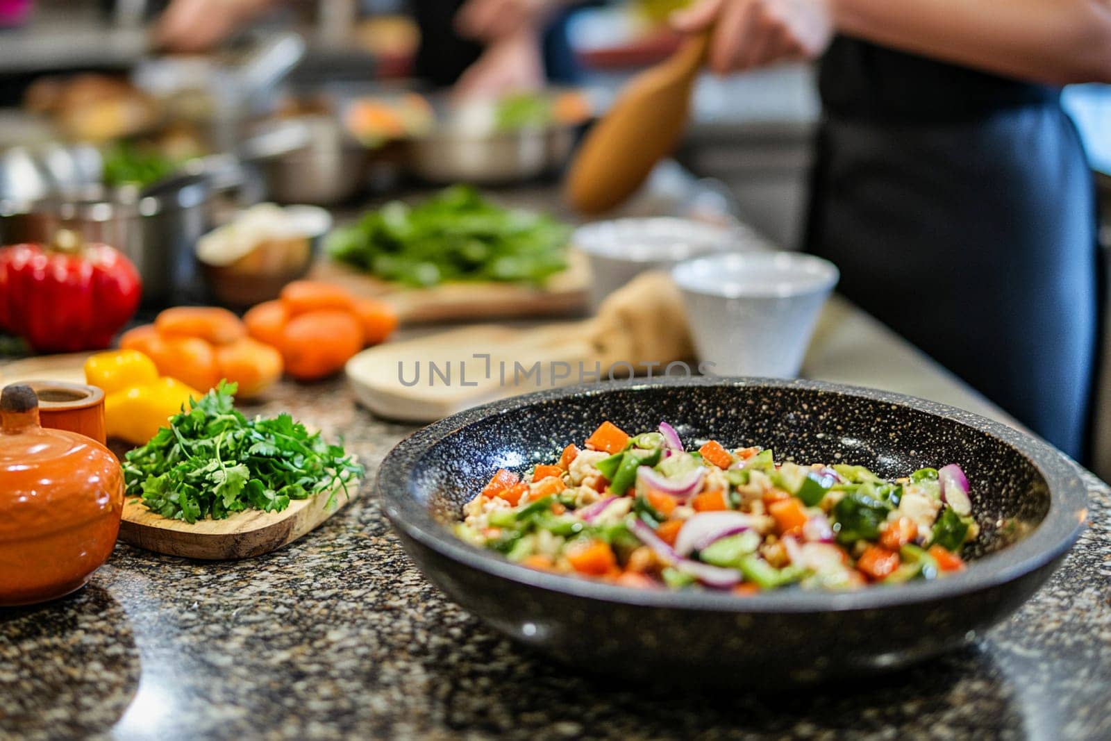 Participants chop and mix vibrant vegetables and herbs in a well-equipped kitchen during a healthy cooking class focused on vegetarian meals.