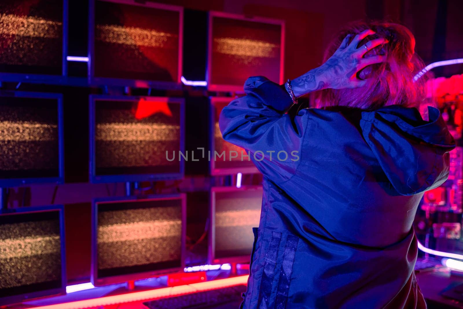 Woman hacker failing. Angry Asian woman wearing a black jacket hacking programming system access denied on computer monitor display. Hacker unsuccessful cracking cyberattack