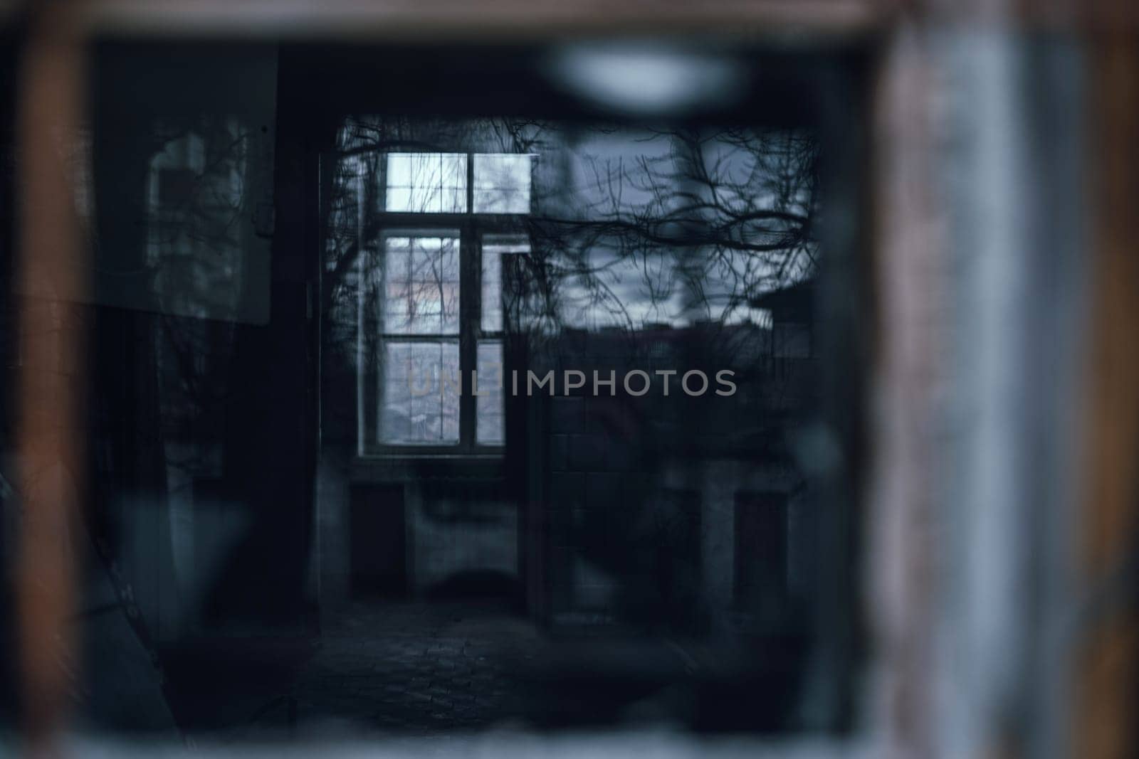 old window in an ancient brick wall in an abandoned farm barn. High quality photo