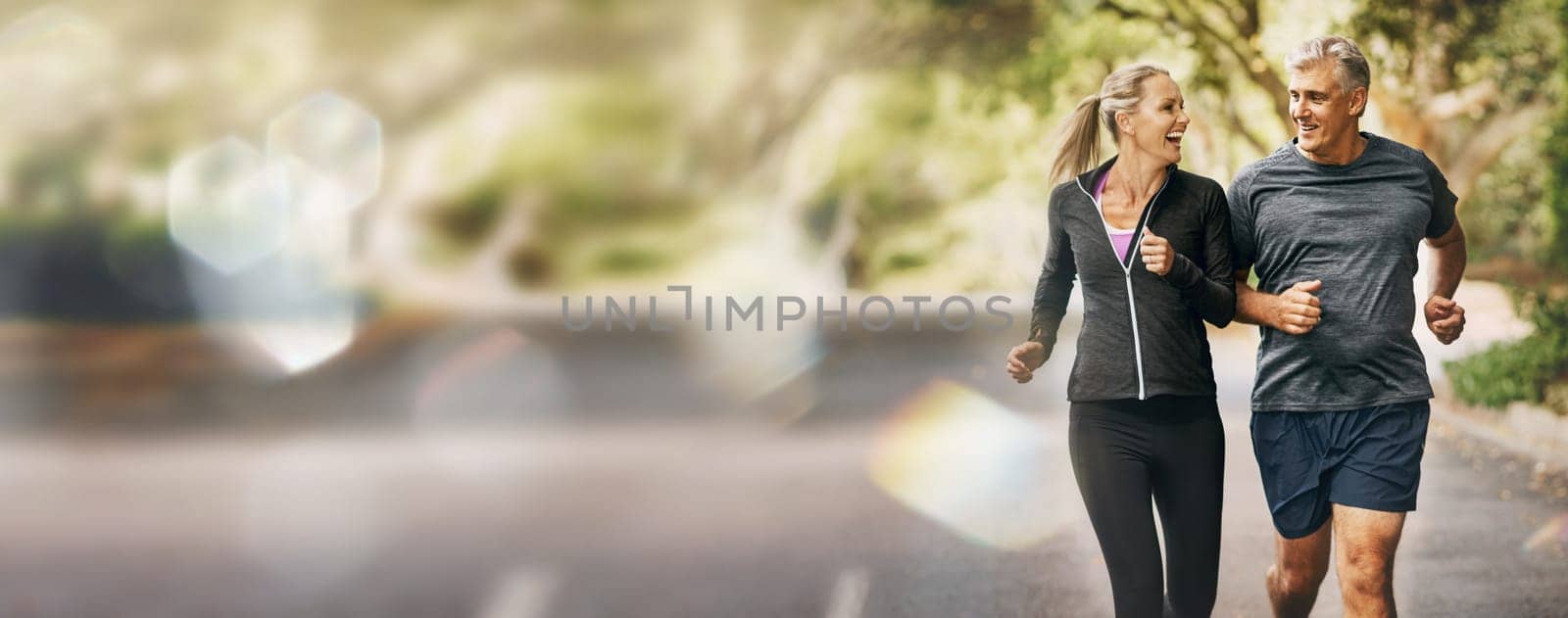 Mature, couple, running and fitness with mockup space and bokeh with smile from sport on road. Exercise, training and workout of a happy athlete on a street for health and wellness together outdoor.