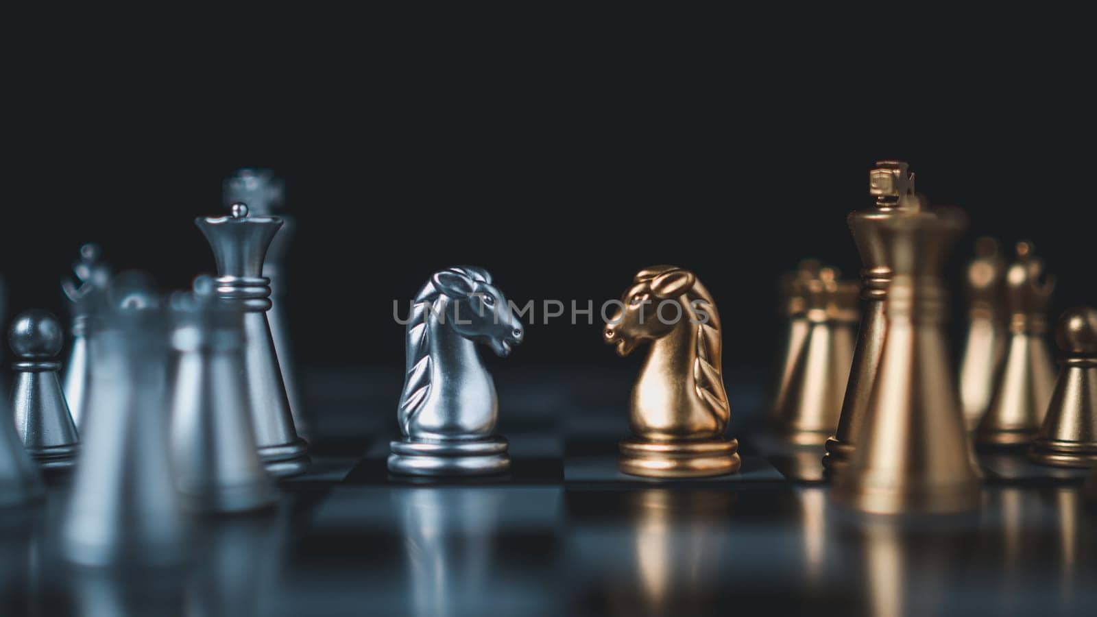 Gold and silver chess pieces in chess board game for business comparison. Leadership concepts, human resource management concepts. by Unimages2527