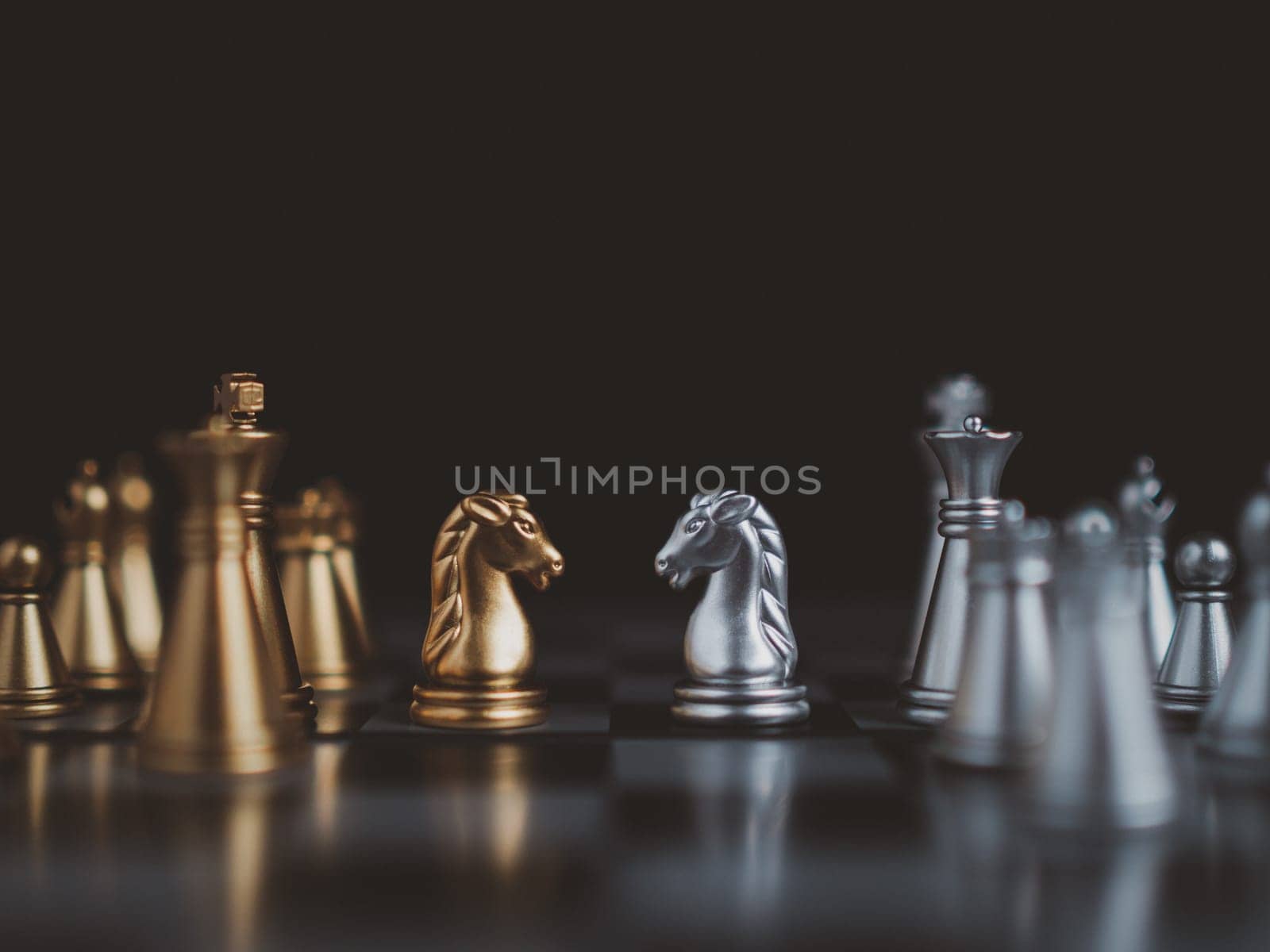 Gold and silver chess pieces in chess board game for business comparison. Leadership concepts, human resource management concepts.