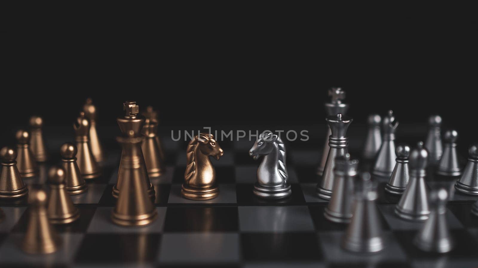 Gold and silver chess pieces in chess board game for business comparison. Leadership concepts, human resource management concepts. by Unimages2527